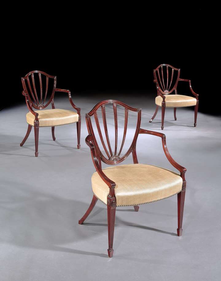 A SET OF SIX GEORGE III MAHOGANY OPEN ARMCHAIRS ATTRIBUTED TO GILLOWS